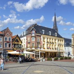 Sittard, Holland, August 2015: Market square in the center of Sittard on a summer day with old buildings and people enjoying the sun